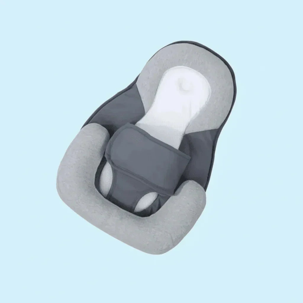 Babywig voor het ledikant
